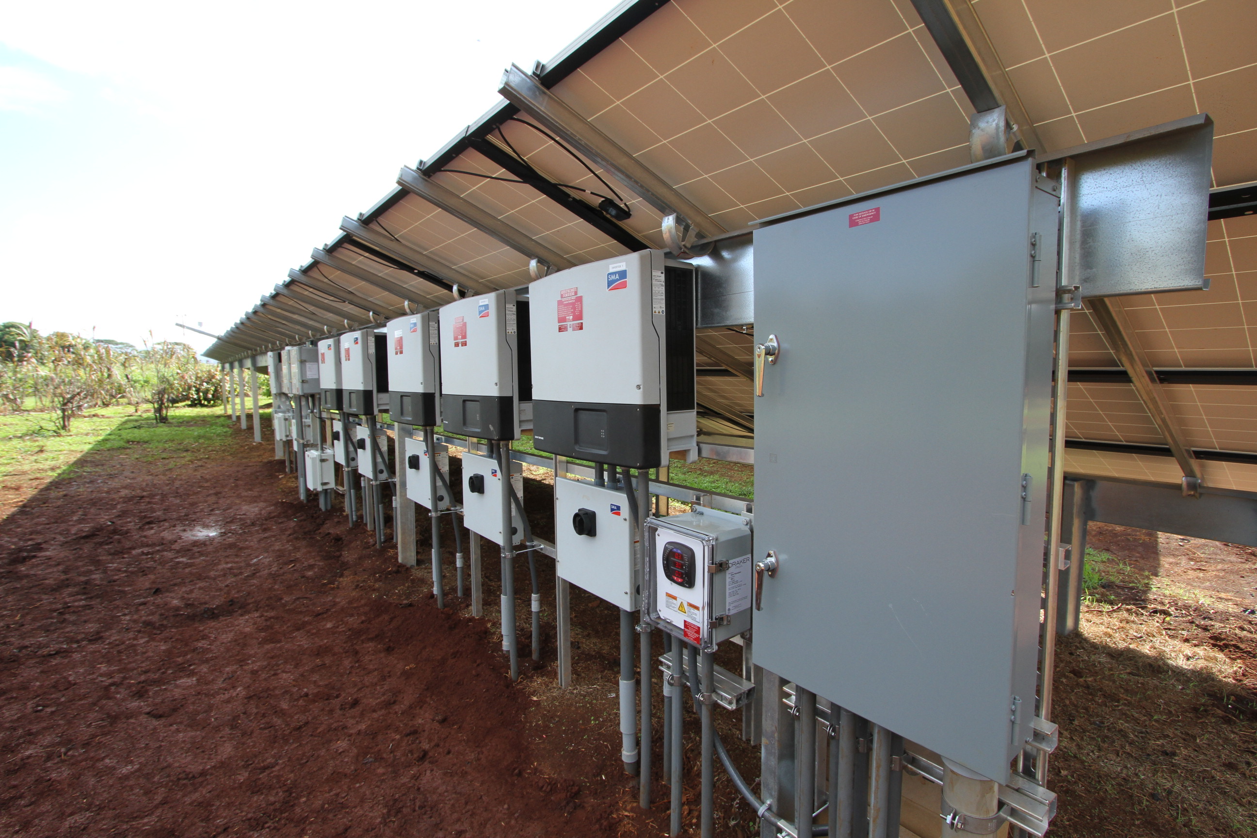 Inverters mounted behind the last row of modules, enjoying the view.