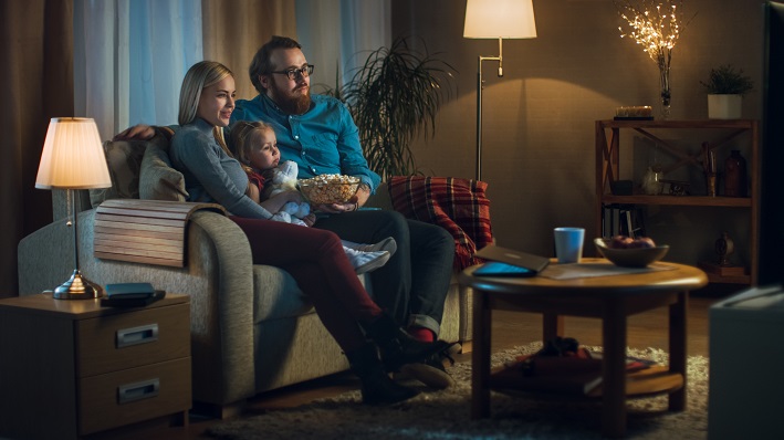 Long Shot of a Father, Mother and Little Girl Watching TV.
